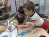 Preschoolers engaged in a month-long upcycling challenge.