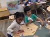 Preschoolers engaged in a month-long upcycling challenge.