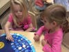 Preschoolers engaged in a month-long upcycling challenge.
