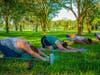 Residents enjoy yoga at Crescent Lake Park. 