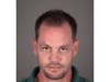 Thomas Robert Schnitzhofer is accused of breaking a guitar over a senior citizen's head. 
