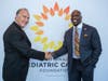 PCF CEO David Frazer welcomes WWE wrestler Titus O'Neil to the 16th Annual Fashion Funds the Cure.
