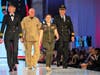 Delta  pilots Mary Ana Gilbert and Matt Moss and retired Sheriff's pilot Kevin Johnson escort Mirelys Santiago-Gonzalez.