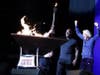 Tampa Mayor Jane Castor helps light the cauldron. 