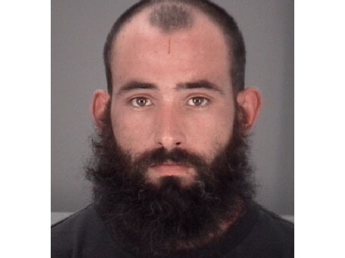 Jesus Ferrer Jr. is accused of hitting his girlfriend with sweet and sour sauce packets. 