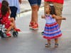 A little girl celebrates the end of afternoon thunderstorms at Julian B. Lane Riverfront Park. 