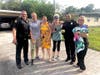 Officer Brian Origlio, left, poses with some of the residents who helped him capture the abandoned pups. 