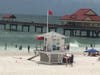 The rescue stations raise a red flag to warn beach visitors of hazards. 