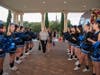Riverview cheerleaders usher teachers and principals into The Regent.