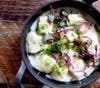 Ricotta Gnocchi with pancetta, black pepper cream, Parmesa, pecorino and scallions.