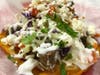 Xtreme Tacos' crunch tostadas are topped with sirloin steak, thin shredded cabbage, pico de gallo, sour cream, guacamole and queso fresco. .