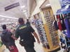Deputies walk the teen out of the store in handcuffs.