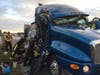 A tractor-trailer truck transporting mail collided with another tractor-trailer truck, causing mail to be scattered across Interstate 75.