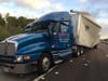 A tractor-trailer truck transporting mail collided with another tractor-trailer truck, causing mail to be scattered across Interstate 75.