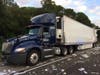 A tractor-trailer truck transporting mail collided with another tractor-trailer truck, causing mail to be scattered across Interstate 75.