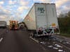 A tractor-trailer truck transporting mail collided with another tractor-trailer truck, causing mail to be scattered across Interstate 75.