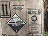 Among the debris were two boxes marked "corrosive," which contained nine 1-gallon containers of muriatic acid. 