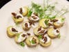 grasshoppers on potato medallions with creme fraiche