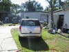 A Riverview couple has been arrested after 12 stolen vehicles and dozens of car parts were found during a search of their home.