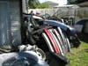 A Riverview couple has been arrested after 12 stolen vehicles and dozens of car parts were found during a search of their home.
