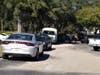 FBI agents join sheriff's investigators at the scene of the robbery. 