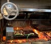 The kitchen's wood-fired grill is 14 feet long.