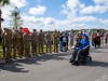 Maj. Ed Gilchrist is applauded by military members as he approaches his new home in Wesley Chapel. 