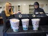 Students prepare to deliver an order of custom coffees.