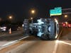A tractor-trailer truck overturned on I-75 after colliding with a large tire on the highway Saturday.