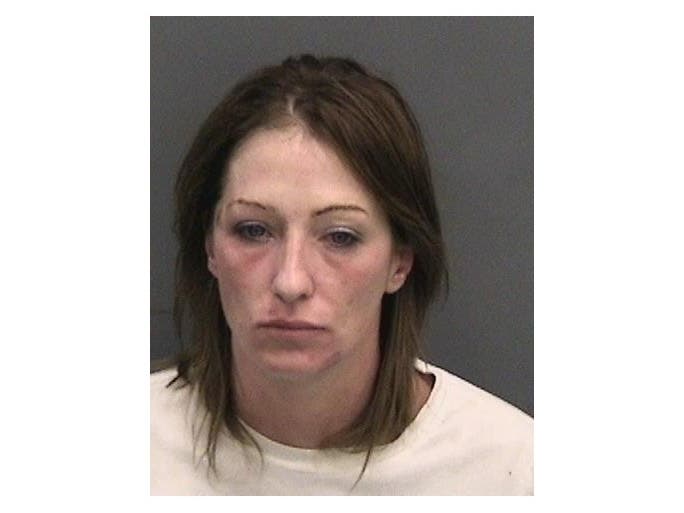A Tampa woman was arrested after store security said they found her attempting to build an explosive device while shopping in a Walmart with her child. 