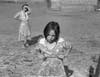 Dorothea Lange's 1939 photo "Child and her Mother, Wapoto Yakima Valley, Washington."