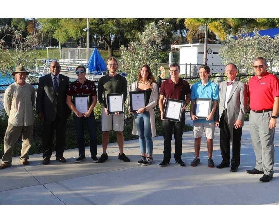 From left are Clifford Patterson, City of Clearwater City Manager Bill Horne, lifeguards Jonathan House, Cameron Gasky, Dannah Fuller, Noah Barker, William Armstrong IV, Clearwater Mayor George Cretekos and Red Cross Regional CEO Eric Corliss.