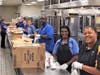 School district food service workers prepare the free breakfasts and lunches. 
