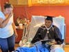 Calles' mother can't hold back her tears as her son looks over his newly minted diploma.