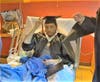 Calles switches the tassel on his mortarboard to the opposite side, the traditional response to graduating.