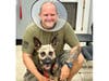 In a show of sympathy, Vise's handler, Deputy Scott Cronin, dons the dog's protective collar. 