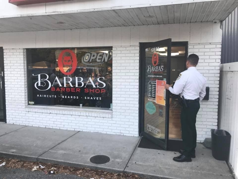 Hillsborough County Sheriff Chad Chronister visits businesses deemed nonessential to let the owners know about the new rules. 