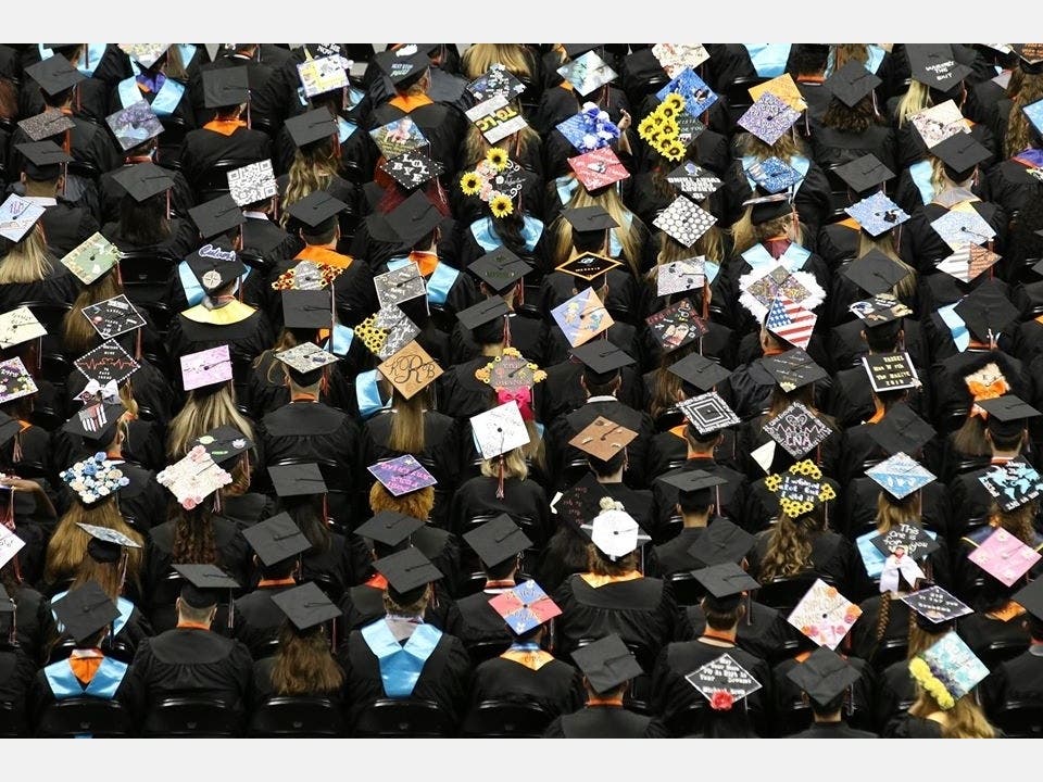 Pasco County seniors express their individuality on the tops of their mortar boards during last year's graduation ceremonies.