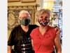 Darrell Painter, right, leader of the Little Dresses sewing volunteers at Hyde Park United Methodist Church and her husband, Brookman, pose in their face masks.