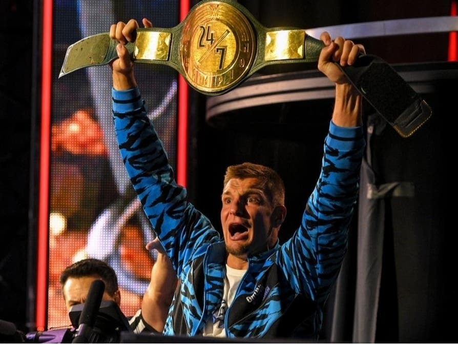 Rob Gronkowski holds up his WWE 24/7 championship belt. Reports say he's coming out of NFL retirement to play for the Bucs.