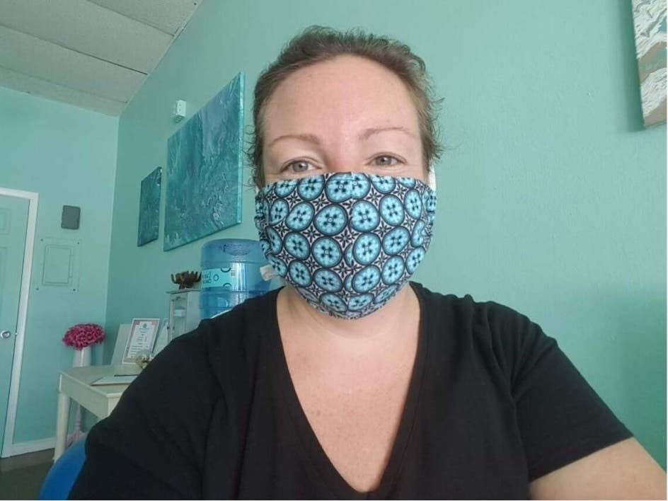 With unexpected time on her hands, massage therapist Courtney Atkins began making tie-on face masks make from colorful fabric. 
