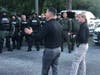 Sheriff Chad Chronister speaks with deputies as they prepare to face the crowds in full riot gear.