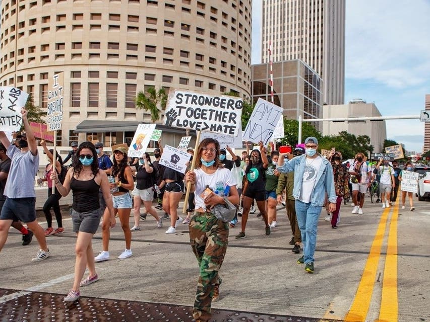Protesters walk through the streets of downtown Tampa Tuesday, ending up at the Franklin Manor bar where they protested comments made by one of the restaurant's owners. See more photos at https://www.instagram.com/kimberlydefalco/