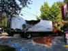 An out-of-control delivery truck crashed into a traffic light pole just before 7 a.m. Wednesday, knocking out the power supply for the signal.