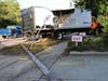 An out-of-control delivery truck crashed into a traffic light pole just before 7 a.m. Wednesday, knocking out the power supply for the signal.