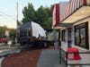 An out-of-control delivery truck crashed into a traffic light pole just before 7 a.m. Wednesday, knocking out the power supply for the signal.