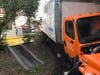 An out-of-control delivery truck crashed into a traffic light pole just before 7 a.m. Wednesday, knocking out the power supply for the signal.