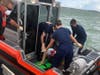 The Coast Guard rescued a 48-year-old man with a leg injury from One Tree Island near Sand Key, Saturday.