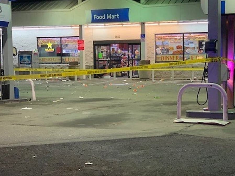 Deputies said about 250 people were gathered outside the gas station when a fight broke out and multiple people began shooting. 