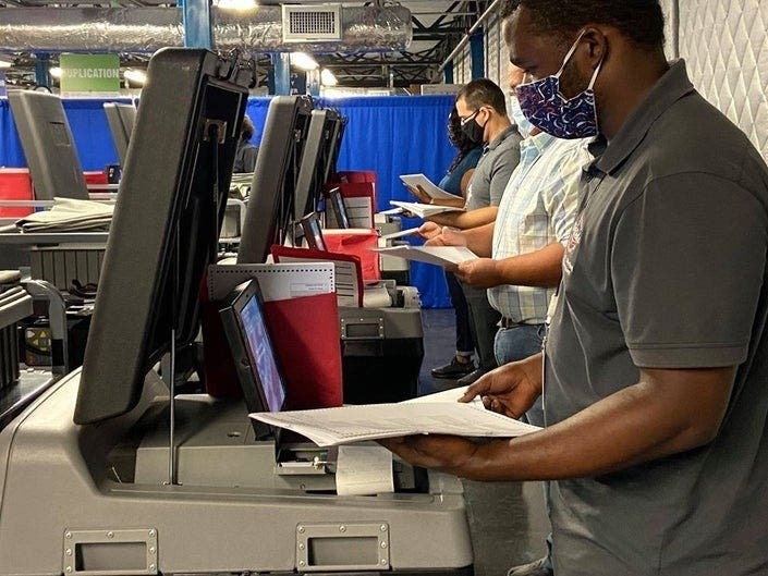 Hillsborough County elections workers test the voting equipment prior to the Aug. 18 primary.